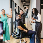 A joyful team moment highlighting collaboration, energy, and a positive workplace culture Church Payroll Services in Maryland