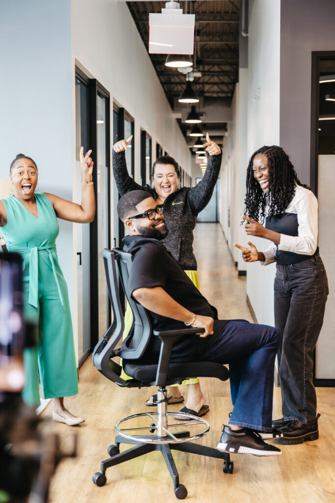 A joyful team moment highlighting collaboration, energy, and a positive workplace culture Church Payroll Services in Maryland